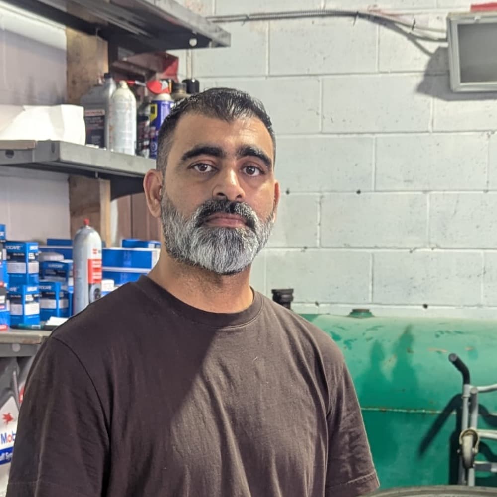 Rickey, owner of Rexdale Auto Detailing, in the shop on Kipling Ave