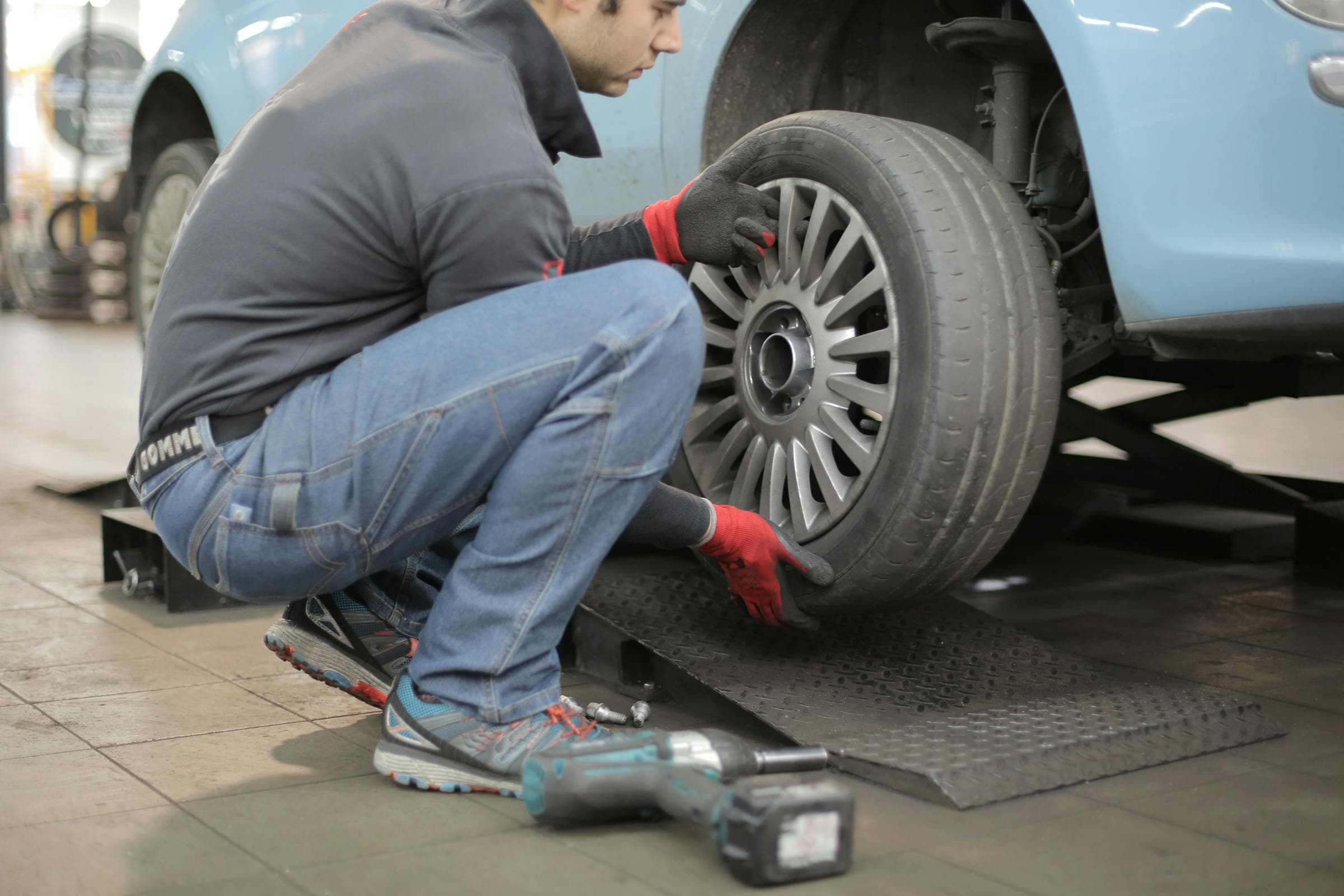 Used tire being inspected at Rexdale Auto Detailing